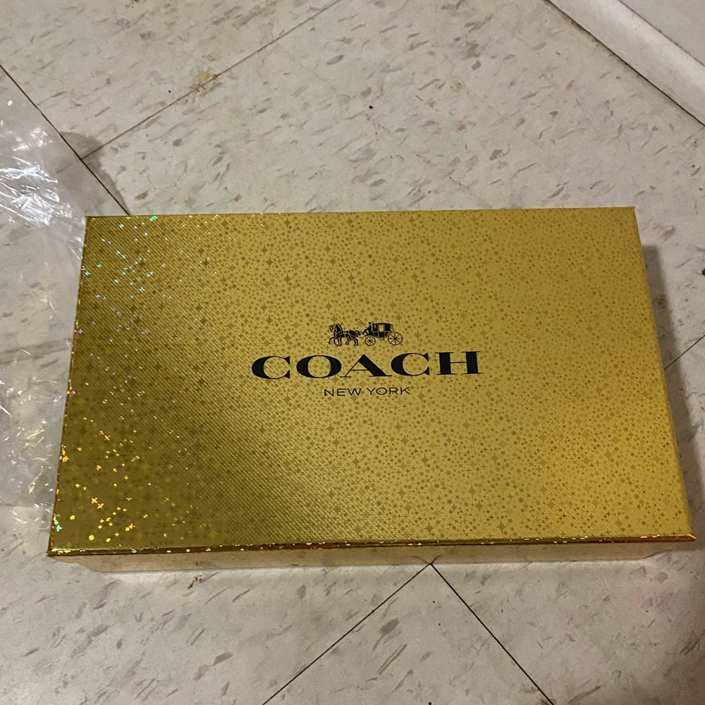 Wristlet Coach bag.